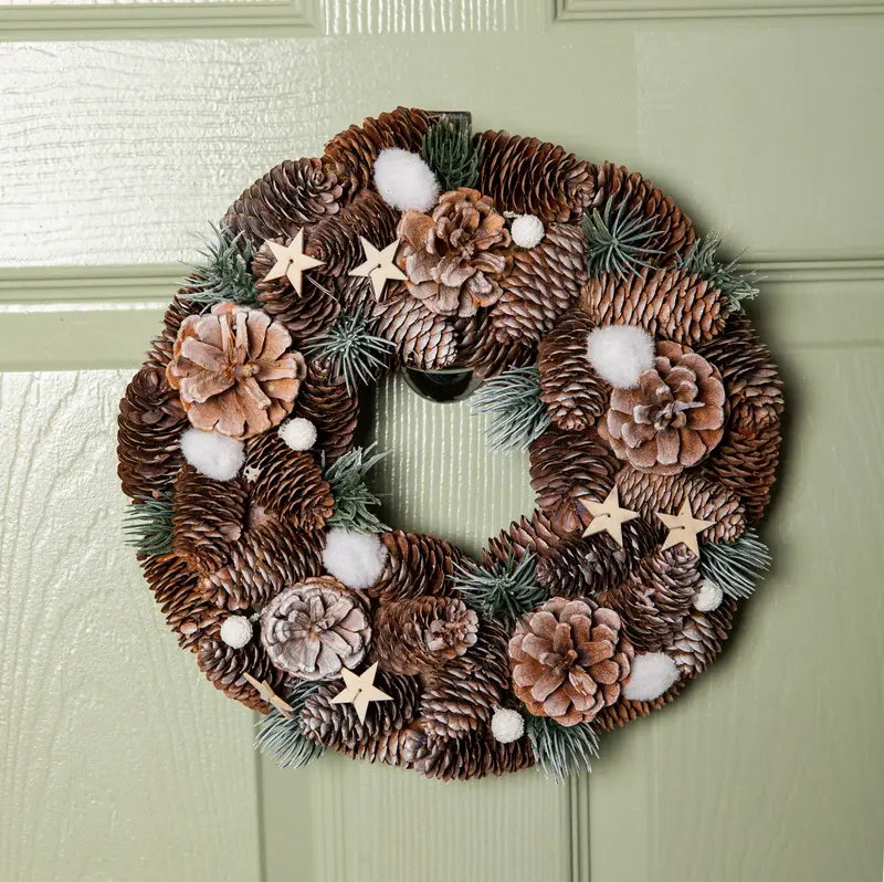 30cm Mini Frosted Wreath Adorned with Pine Cones and Wooden Star Accents