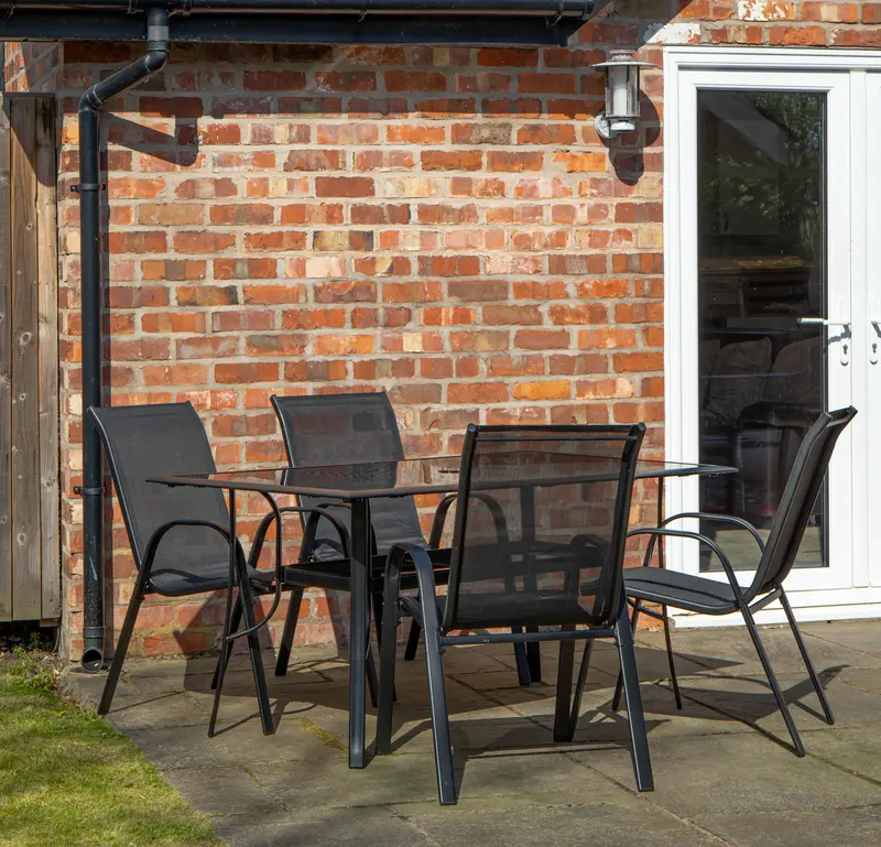 Compact Four-Person Garden Dining Set – Glass-Top Table with Stylish Chairs