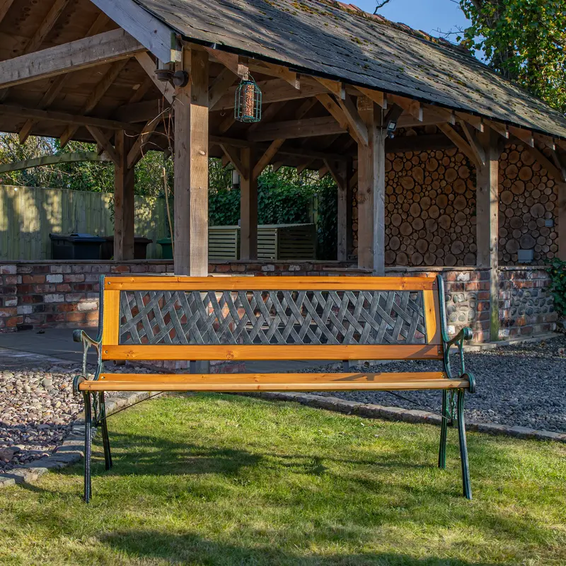 Two-Seat Cast Iron & Wood Garden Bench with Decorative Lattice Paneling – Outdoor Patio Seating